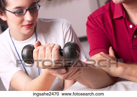 Physical therapist with patient View Large Photo Image Stock Image - Physical therapist with patient . Fotosearch