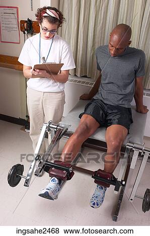 Stock Photo - Physical therapist with patient . Fotosearch