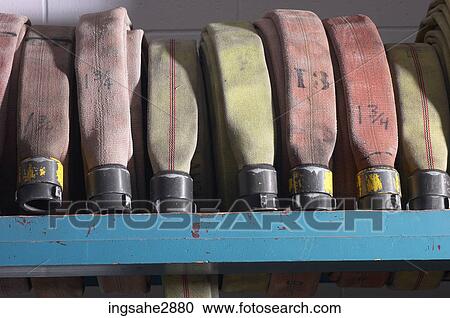 Row of fire hoses View Large Photo Image Stock Image - Row of fire hoses . Fotosearch