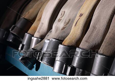 Stock Image - Row of fire hoses . Fotosearch