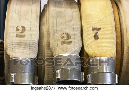 Row of fire hoses View Large Photo Image Stock Photo - Row of fire hoses . Fotosearch