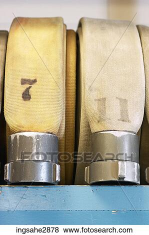 Stock Photo - Row of fire hoses . Fotosearch