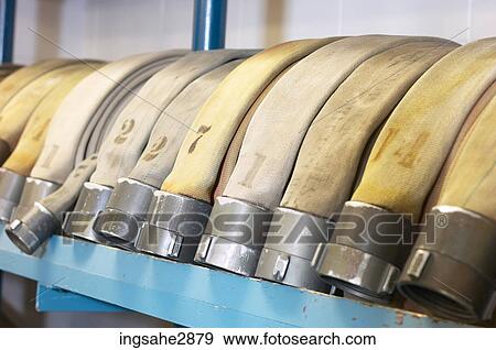 Row of fire hoses View Large Photo Image Stock Photo - Row of fire hoses . Fotosearch