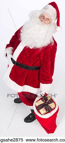 Stock Photography - Santa with bag of presents . Fotosearch