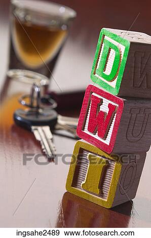 Shot glass car keys and DWI blocks View Large Photo Image Stock Photo - Shot glass car keys and DWI blocks. Fotosearch