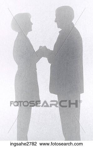 Silhouette of couple behind screen View Large Photo Image Stock Image - Silhouette of couple behind screen . Fotosearch