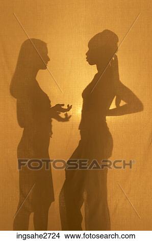 Picture - Silhouettes of two women . Fotosearch