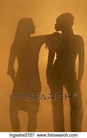 Silhouettes of two women View Large Photo Image Stock Photo - Silhouettes of two women . Fotosearch