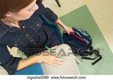 Student reaching into bag View Large Photo Image Stock Photo - Student reaching into bag. Fotosearch