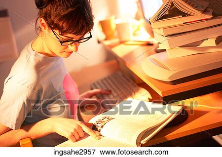 Student studying at desk View Large Photo Image Stock Photo - Student studying at desk . Fotosearch