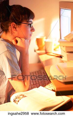 Student studying at desk View Large Photo Image Stock Photo - Student studying at desk . Fotosearch