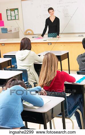 Teacher in classroom full of students a85 View Large Photo Image Stock Photo - Teacher in classroom full of students a85. Fotosearch