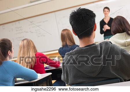 Teacher in classroom full of students a81 View Large Photo Image Stock Photograph - Teacher in classroom full of students a81. Fotosearch