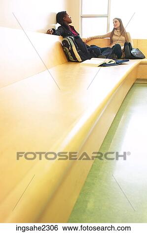 Stock Photograph - Two girls studying a85. Fotosearch