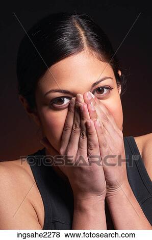 Woman covering mouth View Large Photo Image Stock Photo - Woman covering mouth . Fotosearch