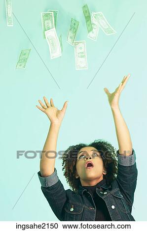 Stock Image - woman grabbing money BE 1. Fotosearch