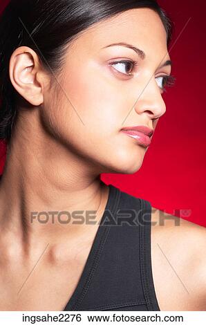 Stock Photograph - Woman in black sleeveless shirt . Fotosearch