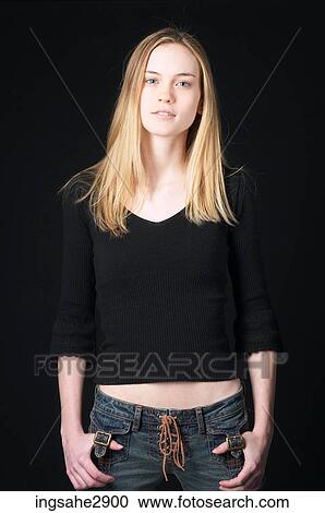 Stock Image - Woman in front of black background . Fotosearch