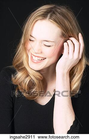 Woman in front of black background View Large Photo Image Stock Image - Woman in front of black background . Fotosearch