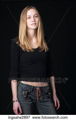 Stock Photo - Woman in front of black background . Fotosearch