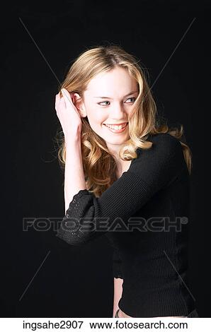 Woman in front of black background View Large Photo Image Stock Photo - Woman in front of black background . Fotosearch