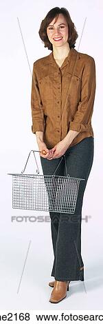 Woman with basket View Large Photo Image Stock Photo - Woman with basket . Fotosearch