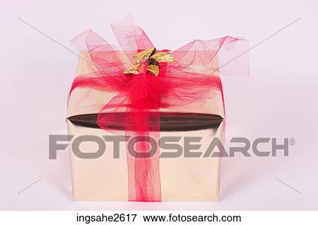Wrapped Christmas present View Large Photo Image Stock Photo - Wrapped Christmas present . Fotosearch