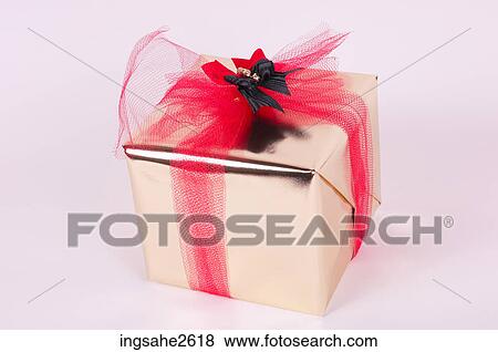 Wrapped Christmas present View Large Photo Image Stock Photo - Wrapped Christmas present . Fotosearch