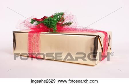 Wrapped Christmas present View Large Photo Image Stock Photo - Wrapped Christmas present . Fotosearch