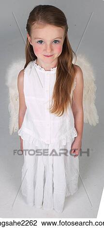 Stock Image - Young girl dressed as angel . Fotosearch