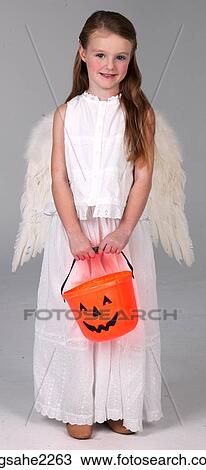 Stock Image - Young girl dressed as angel . Fotosearch