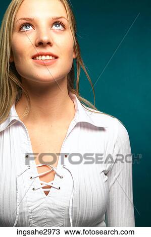 Young girl looking upwards View Large Photo Image Stock Image - Young girl looking upwards . Fotosearch