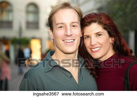Adult couple smiling in mall View Large Photo Image Stock Photo - Adult couple smiling in mall . Fotosearch