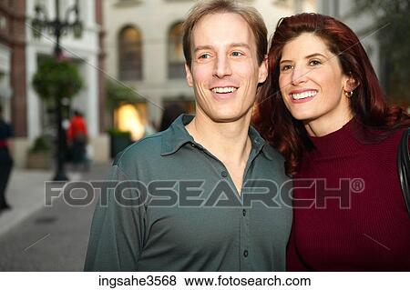 Adult couple smiling in mall View Large Photo Image Stock Photo - Adult couple smiling in mall . Fotosearch