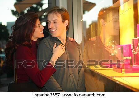 Adult couple window shopping for jewelry View Large Photo Image Stock Photo - Adult couple window shopping for jewelry . Fotosearch