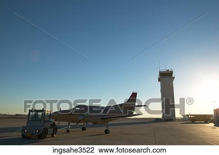 Airplane being pushed by vehicle View Large Photo Image Stock Image - Airplane being pushed by vehicle . Fotosearch