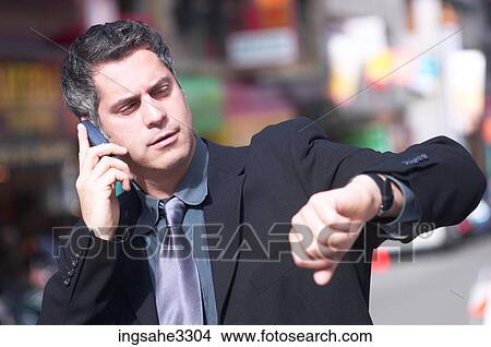 Business man and cellphone View Large Photo Image Picture - Business man and cellphone . Fotosearch