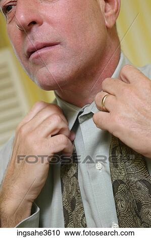 Business man getting dressed View Large Photo Image Stock Image - Business man getting dressed . Fotosearch