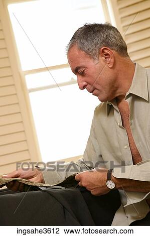 Business man getting dressed View Large Photo Image Stock Image - Business man getting dressed . Fotosearch