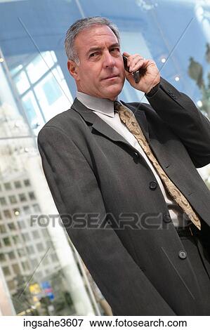 Business man on cellphone View Large Photo Image Stock Photo - Business man on cellphone . Fotosearch