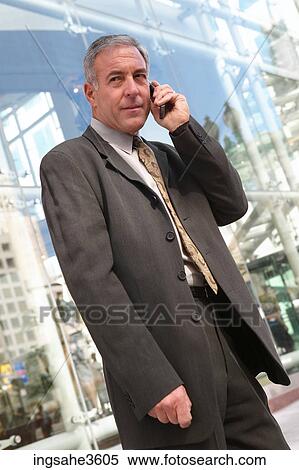 Business man on cellphone View Large Photo Image Stock Photography - Business man on cellphone . Fotosearch