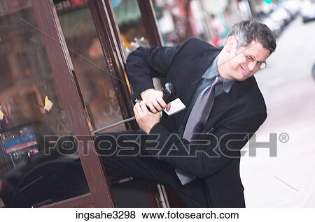 Business man on pay phone View Large Photo Image Stock Photo - Business man on pay phone . Fotosearch
