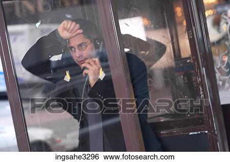Business man on pay phone View Large Photo Image Stock Photograph - Business man on pay phone . Fotosearch