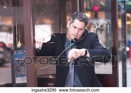 Business man on pay phone View Large Photo Image Stock Photography - Business man on pay phone . Fotosearch