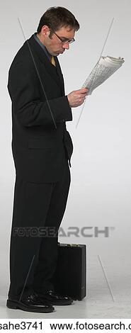 Businessman reading newspaper View Large Photo Image Stock Image - Businessman reading newspaper . Fotosearch