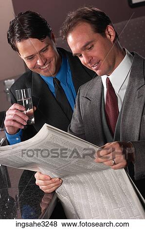 Stock Photo - Businessman reading . Fotosearch