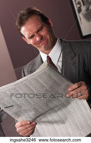 Stock Photograph - Businessman reading . Fotosearch
