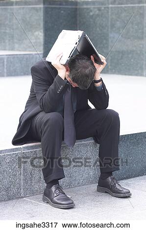 Businessman sitting with laptop View Large Photo Image Stock Photo - Businessman sitting with laptop . Fotosearch