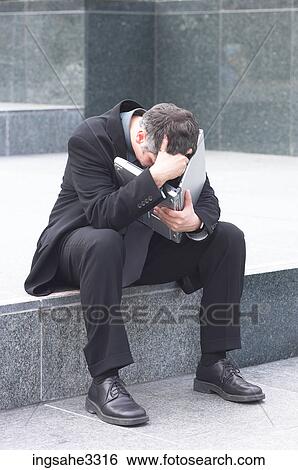 Businessman sitting with laptop View Large Photo Image Stock Photograph - Businessman sitting with laptop . Fotosearch