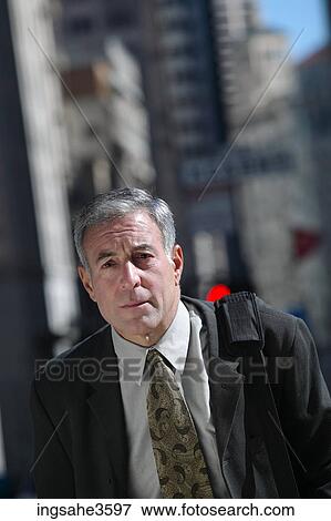 Stock Photo - businessman walking in city . Fotosearch